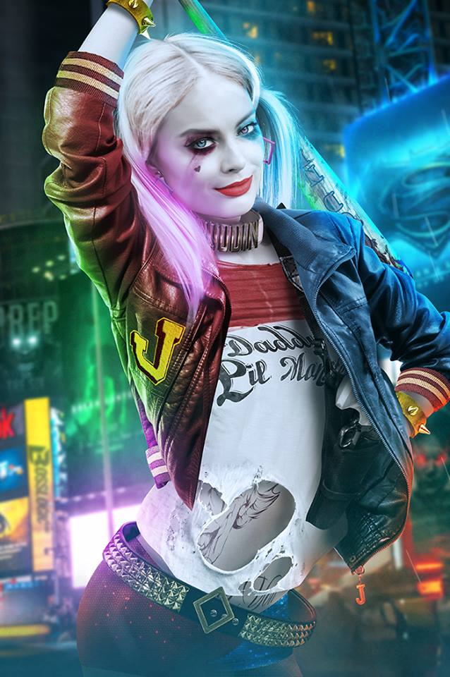 1girls batman_(series) belt blonde_hair blue_eyes blue_strand blue_strand_of_hair blue_wisp_of_hair bracelet celebrity clothes clothing collar dc dc_extended_universe dyed_hair earrings female female_only firearm fully_clothed gun handgun harley_quinn jacket makeup margot_robbie multicolored_hair pale_skin pigtail_band pigtail_ribbon pigtails red_strand_of_hair red_wisp_of_hair revolver scrunchie shorts solo suicide_squad t-shirt tattoos tied_hair twintails weapon