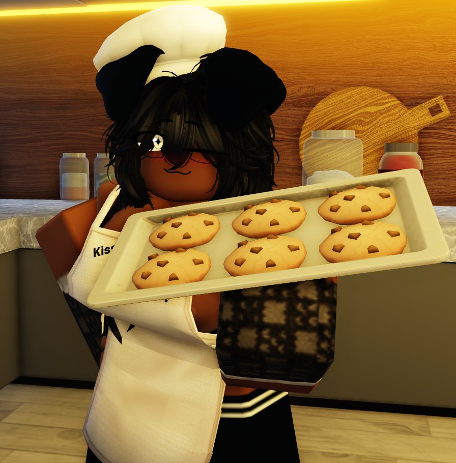 1girls, 3d, 3d (artwork), apron, armwear, black armwear, black ears, black gloves, black hair, black hat, black headwear, black legwear, black thighhighs, blush, chef hat, cookie, dark skin, dark-skinned female, dog ears, ear, female, female focus, female only, food, gloves, hair, hat, headwear, holding, holding object, kira (nitelite), kitchen, legwear, nitelite, oc, offering, offering to viewer, original character, roblox, robloxian, snack, thighhighs, white apron, wink, winking, winking at viewer