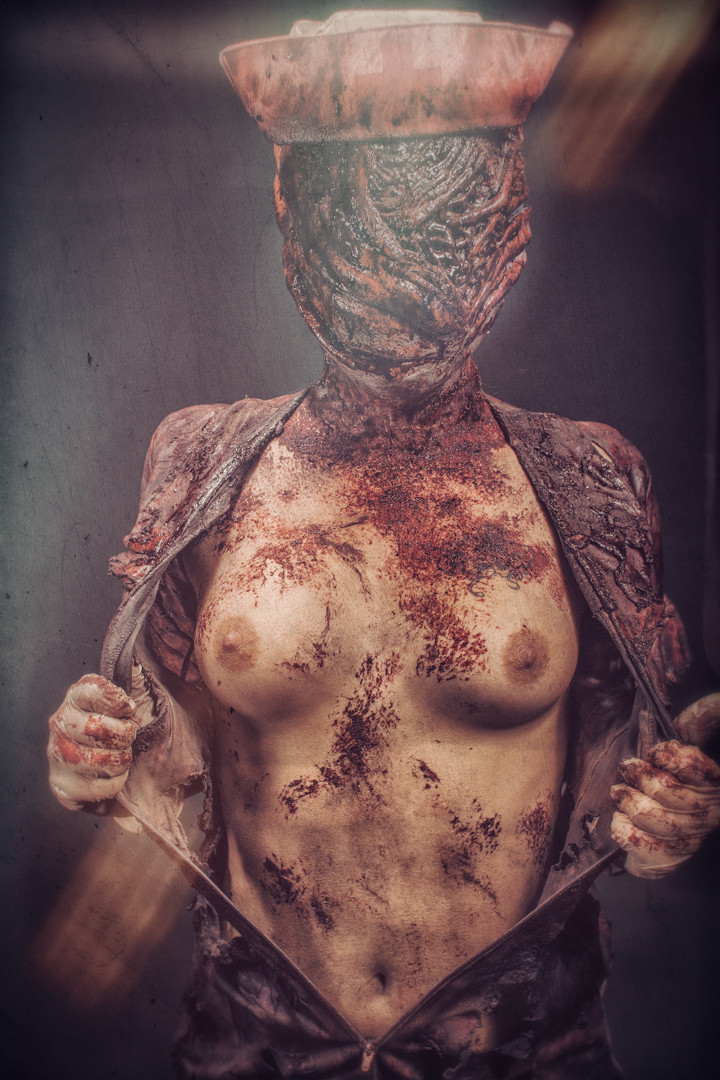 1girls, areolae, blood, breasts, bubble head nurse, clothes, cosplay, female, female only, gloves, looking at viewer, medium breasts, nipples, nurse, nurse (silent hill), nurse cap, open clothes, photo, silent hill, silent hill (film), silent hill homecoming, solo, stomach, upper body, white gloves