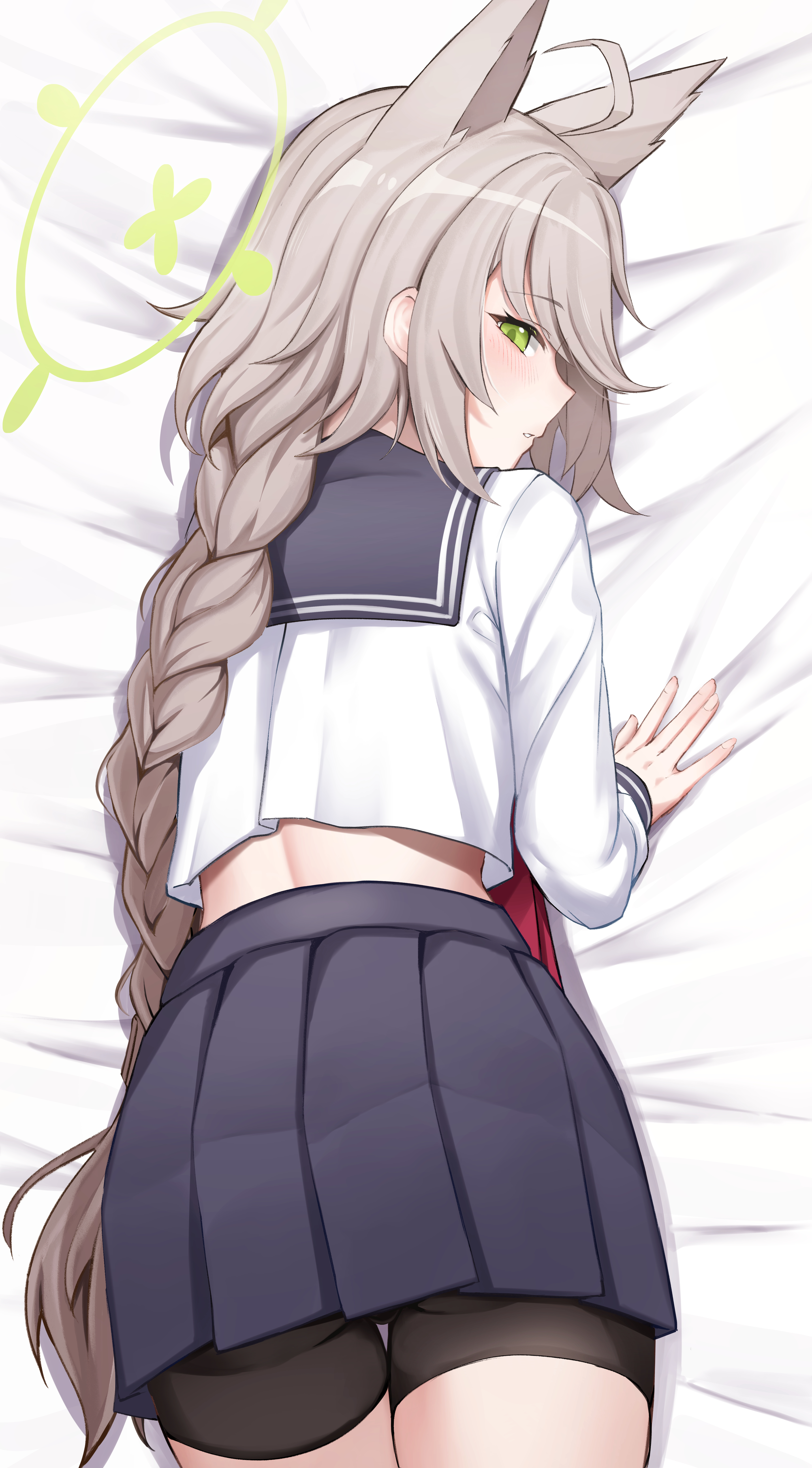 absurdres, ahoge, animal ears, bed sheet, bike shorts, black shorts, blue archive, blue skirt, blush, commentary request, female, fox ears, fox girl, green eyes, green halo, grey hair, halo, highres, kuromiz, long hair, long sleeves, looking at viewer, low-braided long hair, low-tied long hair, lying, midriff, miniskirt, multi ear, on bed, on stomach, otogi (blue archive), paid reward available, pleated skirt, profile, school uniform, serafuku, shorts, skirt, solo, very long hair