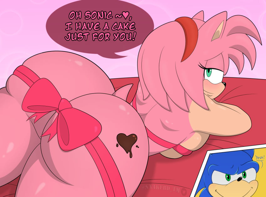 amy_rose ass ass ass_cheeks big_ass big_butt chocolate english_text green_eyes laying_on_bed laying_on_stomach looking_at_viewer looking_back pink_background pink_fur pink_hair plump_ass ribbon sega snakebd sonic_(series) sonic_the_hedgehog_(series) thick_ass thick_thighs valentine's_day voluptuous wide_hips