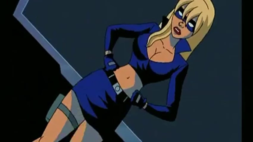 beltskirt blonde_hair blue_gloves blue_shirt blue_skirt cleavage collarbone erotica_jones eye_mask hands_on_hips looking_at_viewer pamela_anderson red_lips screenshot skirt standing stripperella