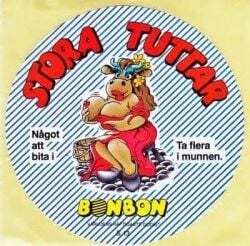 1990 1990s 1990s_(style) 1female betty_babs big_breasts bonbon-slik bonbon_slik breasts brown_body brown_hair cow_girl curvy curvy_milf danish female female_only flower_in_hair furry hair huge_breasts large_breasts long_hair mascot milf nipples tv_screen wardrobe_malfunction stickers