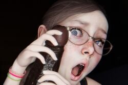 1boy 1girls 3d amazed blue_eyes dark-skinned_male freckles glasses hand_on_penis interracial light-skinned_female open_mouth out_of_frame petite surprised young_female