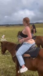 animated bambidoe bimbo bimbo_body bimbo_lips braided_hair french_braid gif horse irl jeans jiggling_ass orange_hair real_life real_person rear_view red_hair riding_horse thong_straps tik_took tiktok visible_underwear whore