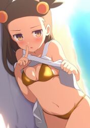 bare_arms bare_belly bare_legs bare_shoulders bare_thighs beach belly_button bikini blush breasts brown_eyes brown_hair cleavage clothes_lift collarbone curakuru dress dress_lift finger_to_mouth gold_bikini groin jasmine_(pokemon) lying on_side outdoors parted_lips pokemon sand small_breasts thighs