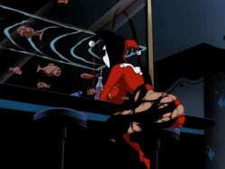 1girls aquarium ass bar_stool batman:_the_animated_series batman_(series) bottle breasts cartoon_network dc dc_comics dcau drinking edit facepaint female female_only fish harley_quinn harley_quinn_(classic) hat human indoors inside jester_cap jester_hat jester_outfit piranha screenshot screenshot_edit sideboob sitting sitting_on_chair solo stool yetig