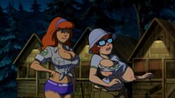 16:9 2girls accurate_art_style animated animated_gif belt black-framed_eyewear black-framed_glasses blush breast_expansion brown_hair bursting_breasts cabin camp_scare cargo_pants cargo_shorts chubby cleavage daphne_blake denim_shorts edit embarrassed erect_nipples female female_only forest freckles glasses hand_on_hip hanna-barbera huge_breasts jean_shorts long_hair medium_hair midriff navel nerd orange_hair outdoors scooby-doo scooby-doo!_camp_scare screenshot screenshot_edit shirt short_shorts short_sleeves shorts t-shirt tearing_clothes tied_shirt tight_clothing topwear trees velma_dinkley white_shirt yetig