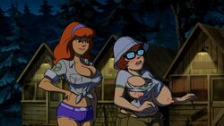 2girls accurate_art_style alternate_breast_size belt black-framed_eyewear black-framed_glasses blush breast_expansion brown_hair bursting_breasts cabin camp_scare cargo_pants cargo_shorts chubby cleavage daphne_blake denim_shorts edit embarrassed erect_nipples female_only forest freckles glasses hand_on_hip hanna-barbera huge_breasts jean_shorts long_hair medium_hair midriff navel nerd nipples orange_hair outdoors scooby-doo scooby-doo!_camp_scare screen_rant_thumbnail_material screenshot screenshot_edit shirt short_shorts short_sleeves shorts tearing_clothes tied_shirt tight_clothing trees velma_dinkley white_shirt yetig