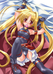 bed blonde_hair blush condom condom_in_mouth fate_testarossa long_hair lying lyrical_nanoha mahou_shoujo_lyrical_nanoha mahou_shoujo_lyrical_nanoha_a's mio_(fastest_lap) mouth_hold nagiyura red_eyes thighhighs tied_hair twintails