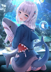 :d aquarium ass bangs blahaj bloop_(gawr_gura) blue_eyes blue_hair blue_hoodie blunt_bangs blush commentary doll_hug eyebrows_visible_through_hair female fish fish_tail gawr_gura hair_ornament highres holding hololive hololive_english hololive_myth hood hood_down hoodie ikea long_sleeves looking_at_viewer looking_back monaka_curl multicolored_hair object_hug open_mouth panties shark_girl shark_tail sharp_teeth shimapan silver_hair sitting smile solo streaked_hair striped striped_panties stuffed_animal stuffed_shark stuffed_toy tail teeth two_side_up underwater underwear virtual_youtuber water