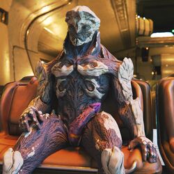 3d_(artwork) alien anthro digital_media_(artwork) erection genitals hi_res humanoid kett_(race) male mass_effect mass_effect_andromeda not_furry nude penis purple_penis ralic_turman sitting solo video_games