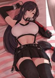 bangs bare_shoulders belt black_gloves black_hair black_skirt black_thighhighs blush breasts collarbone commentary crop_top elbow_gloves elbow_pads female final_fantasy final_fantasy_vii final_fantasy_vii_remake fingerless_gloves gloves highres large_breasts long_hair looking_at_viewer low-tied_long_hair lying midriff miyamoto_issa navel on_back on_bed pillow red_eyes shirt skirt smile solo suspender_skirt suspenders tank_top taut_clothes taut_shirt thighhighs thighs tifa_lockhart white_tank_top