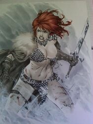 1girls armor big_breasts bikini_armor breasts brown_eyes cape chainmail chainmail_bikini eric_basaldua exposed_breasts exposed_nipples female female_only gloves hair holding_object holding_weapon human human_only large_breasts loincloth long_hair navel nipples red_hair red_sonja red_sonja_(comics) solo sword tagme uncensored weapon